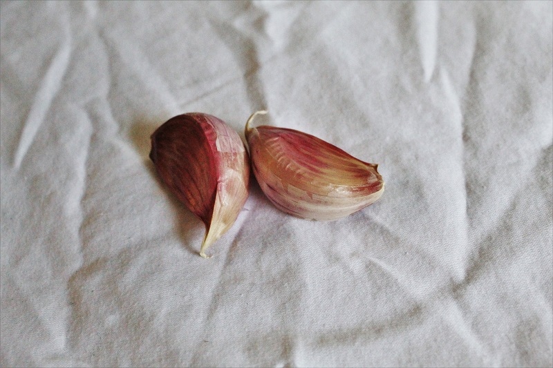 Garlic used to make baked Brussels sprouts, showcasing an easy and flavorful Brussels sprouts recipe.