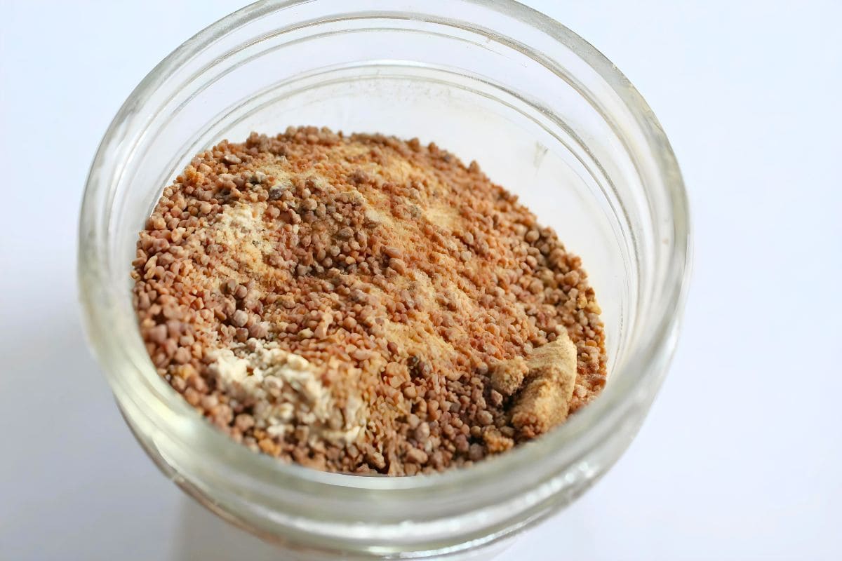 a mixture of coconut sugar & monk fruit extract in a glass container.