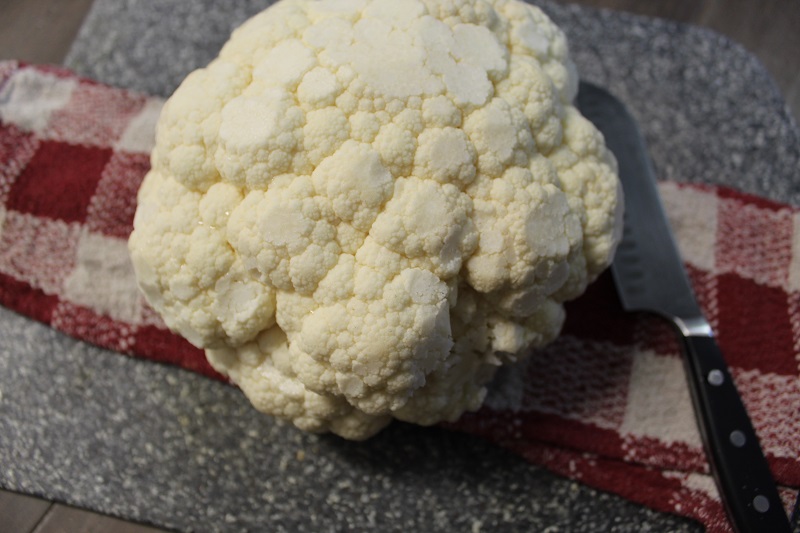 whole raw cauliflower in a flat surface.