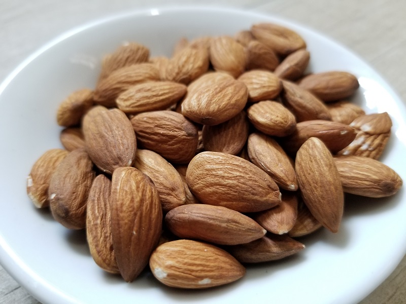 A plate full of almonds.