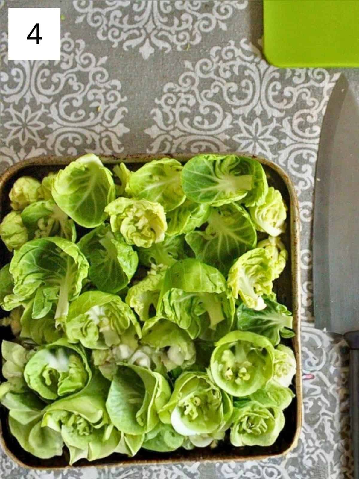 Chopped Brussels sprouts ready to be baked with garlic for a crispy and flavorful side dish.