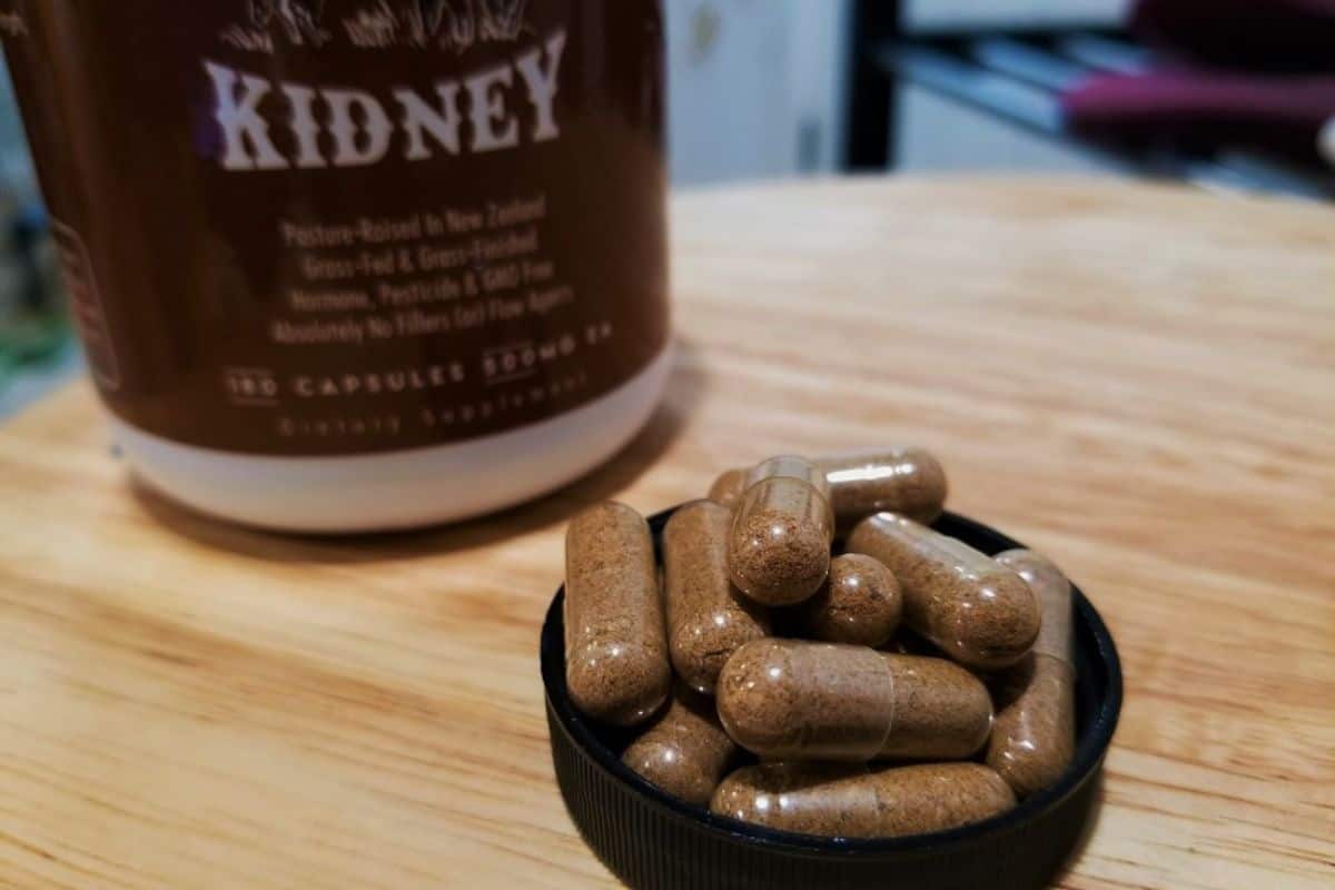 kidney pills sitting on top of a table.