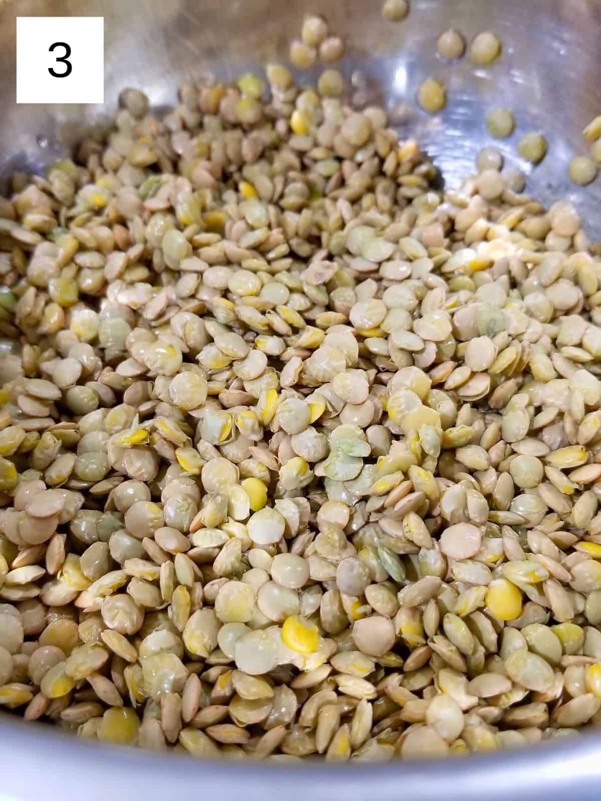 A mixing bowl filled with cleaned lentils.