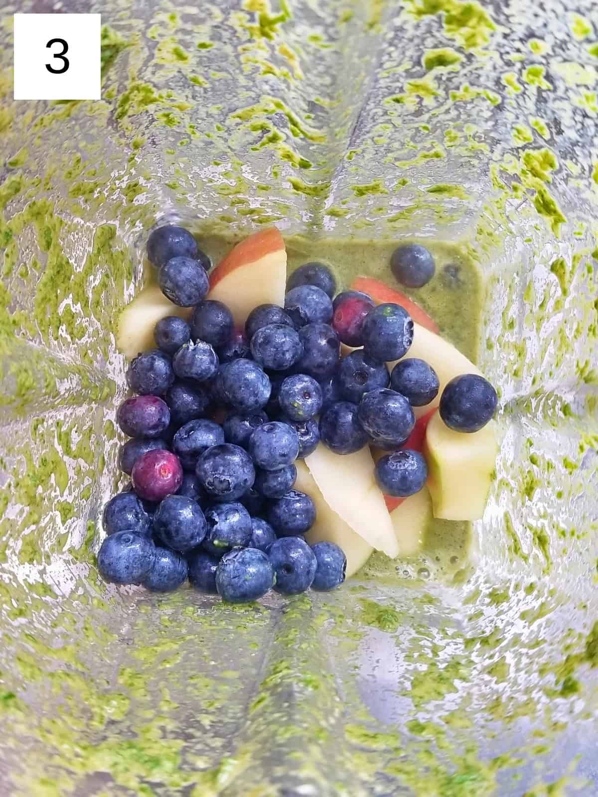 Step 3 for making a low histamine green smoothie, showcasing the blending process with fresh greens and low histamine ingredients.