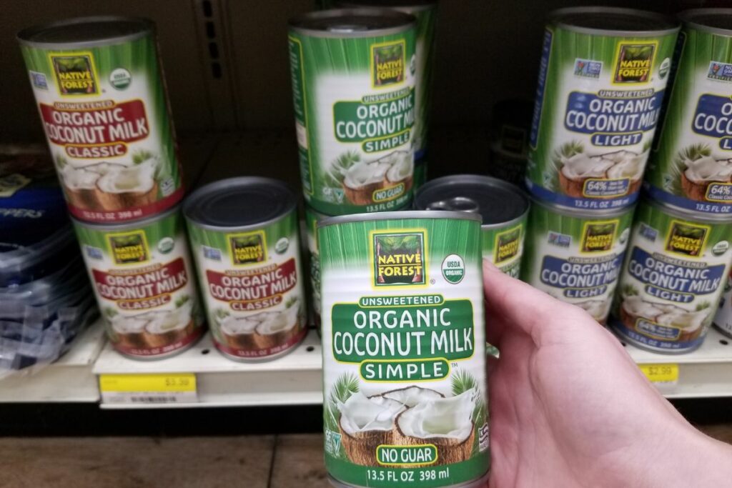 grocery shelf of canned organic coconut milk.