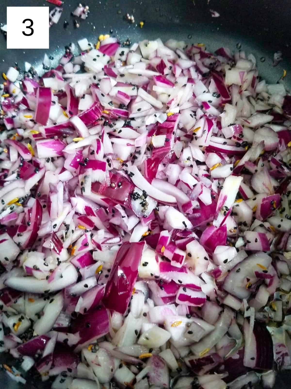 sautéing the onion and seeds together.