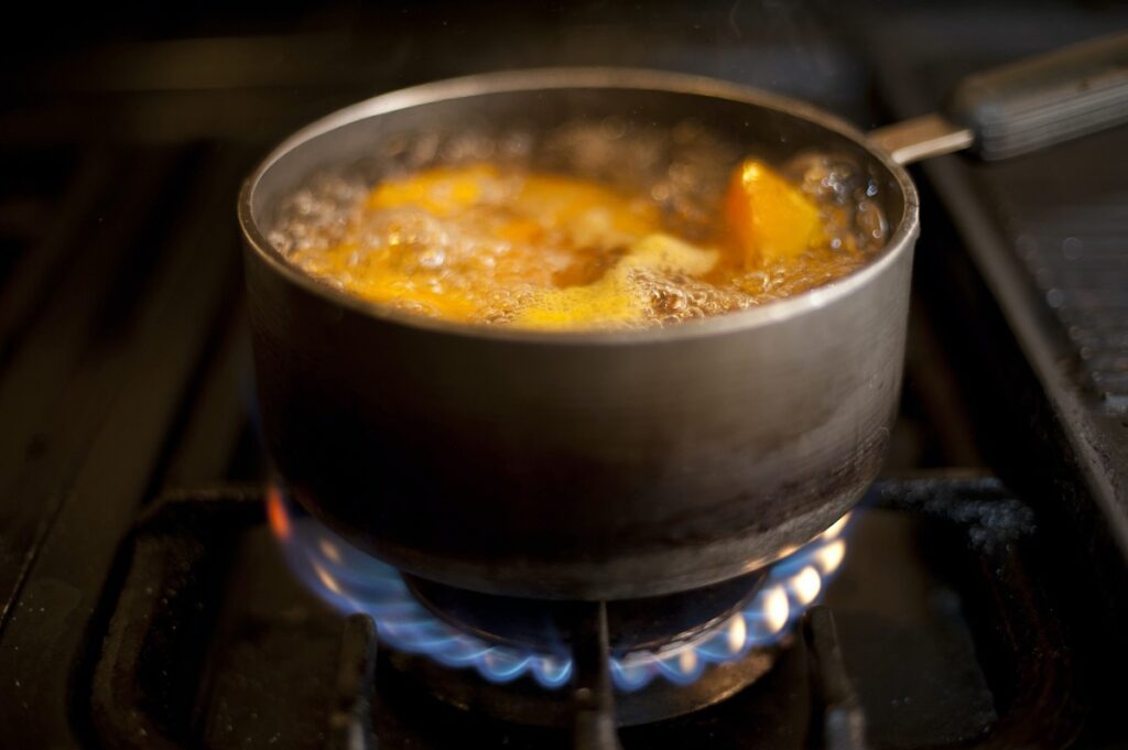 pot of soup boiling on stovetop.