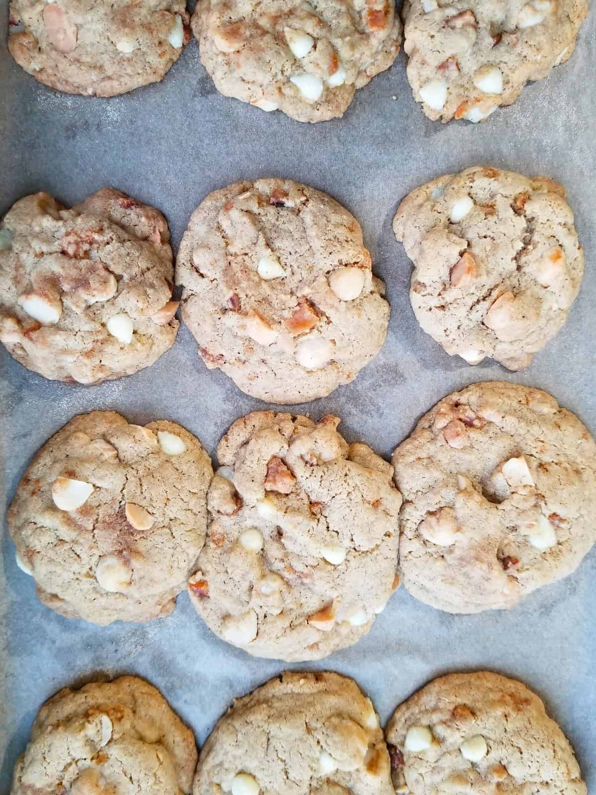 final white chocolate macadamia cookies in a baking tray.