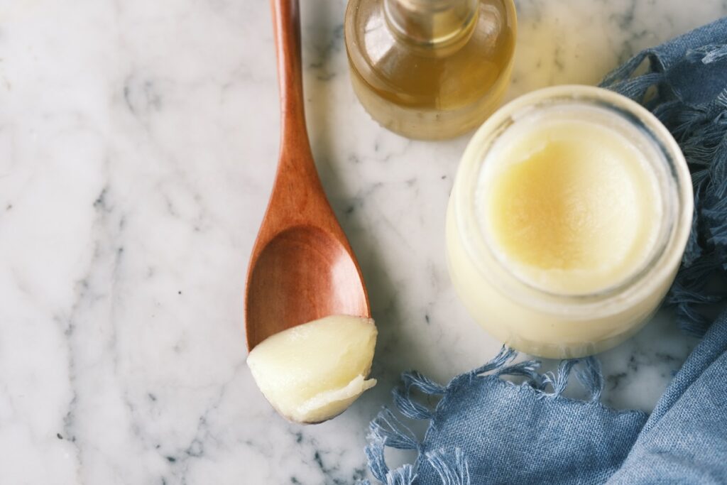 homemade tallow in a glass container.