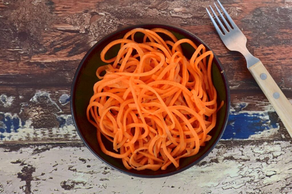 carrot noodles on a plate.