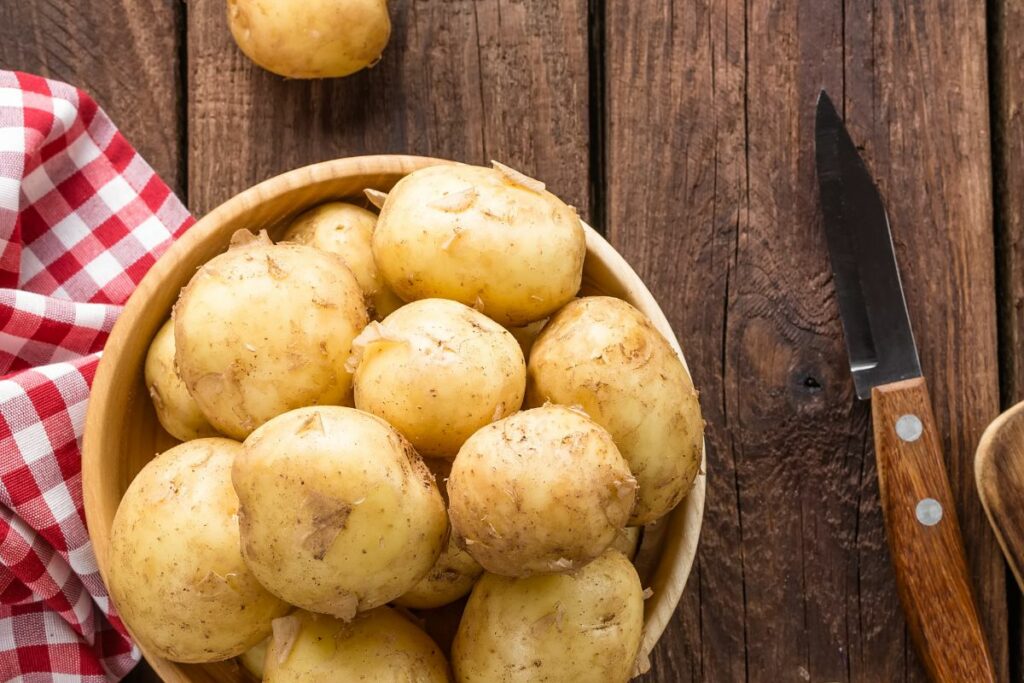 regular potatoes in a wooden bowl.