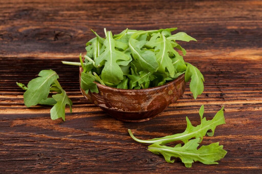 a bowl of fresh green arugula.