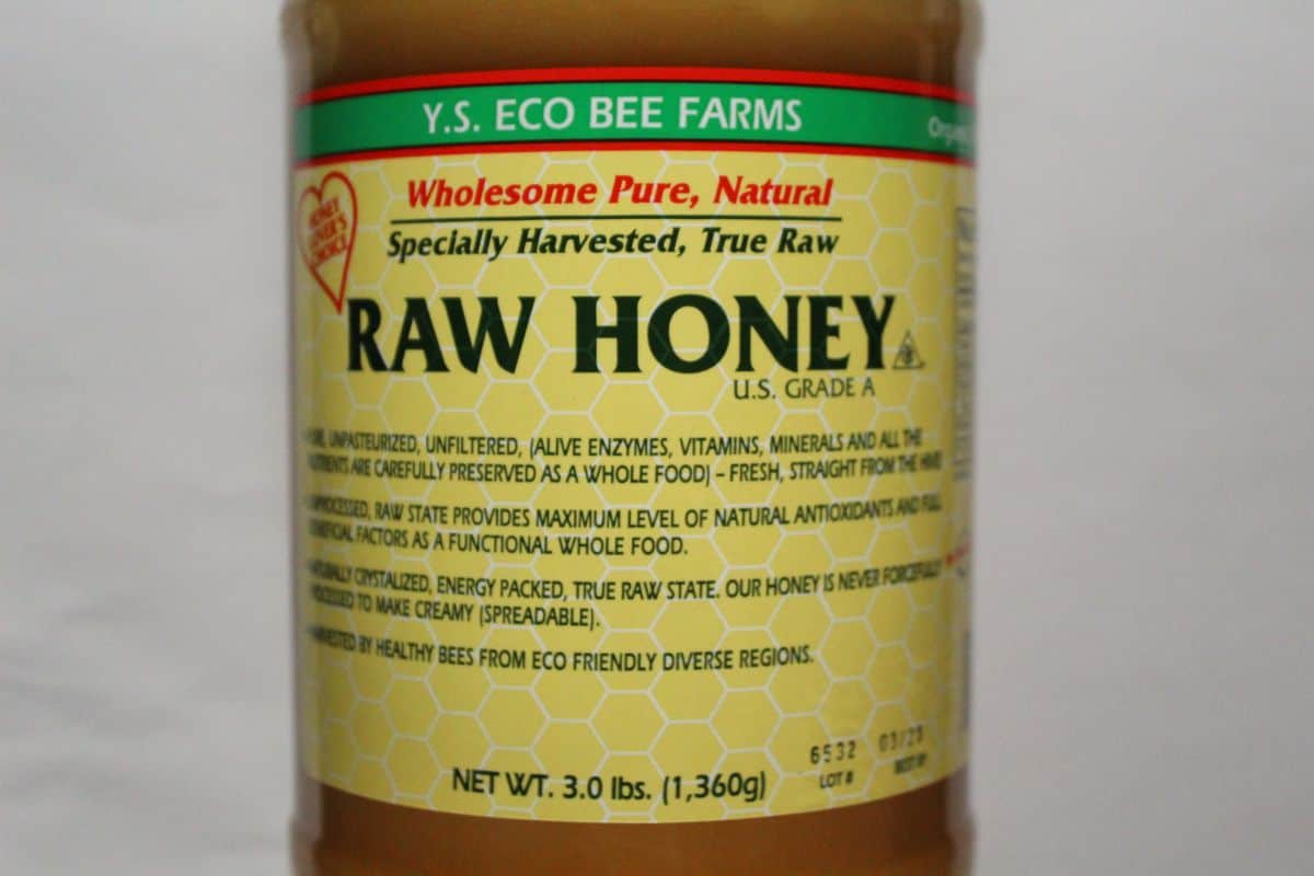 A bottle of Eco bee's farm Raw Honey.