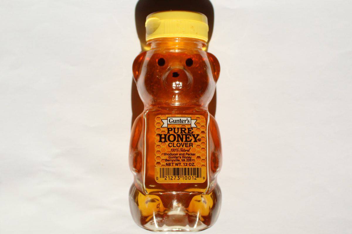 A bear shaped bottle of Gunter's pure honey.