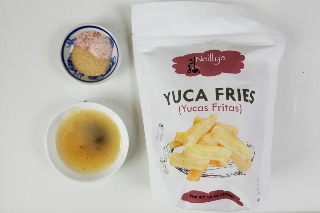 Yuca fries next to dips. 