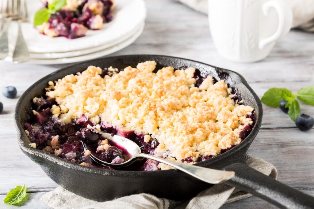 almond flour blueberry cake in a skillet.