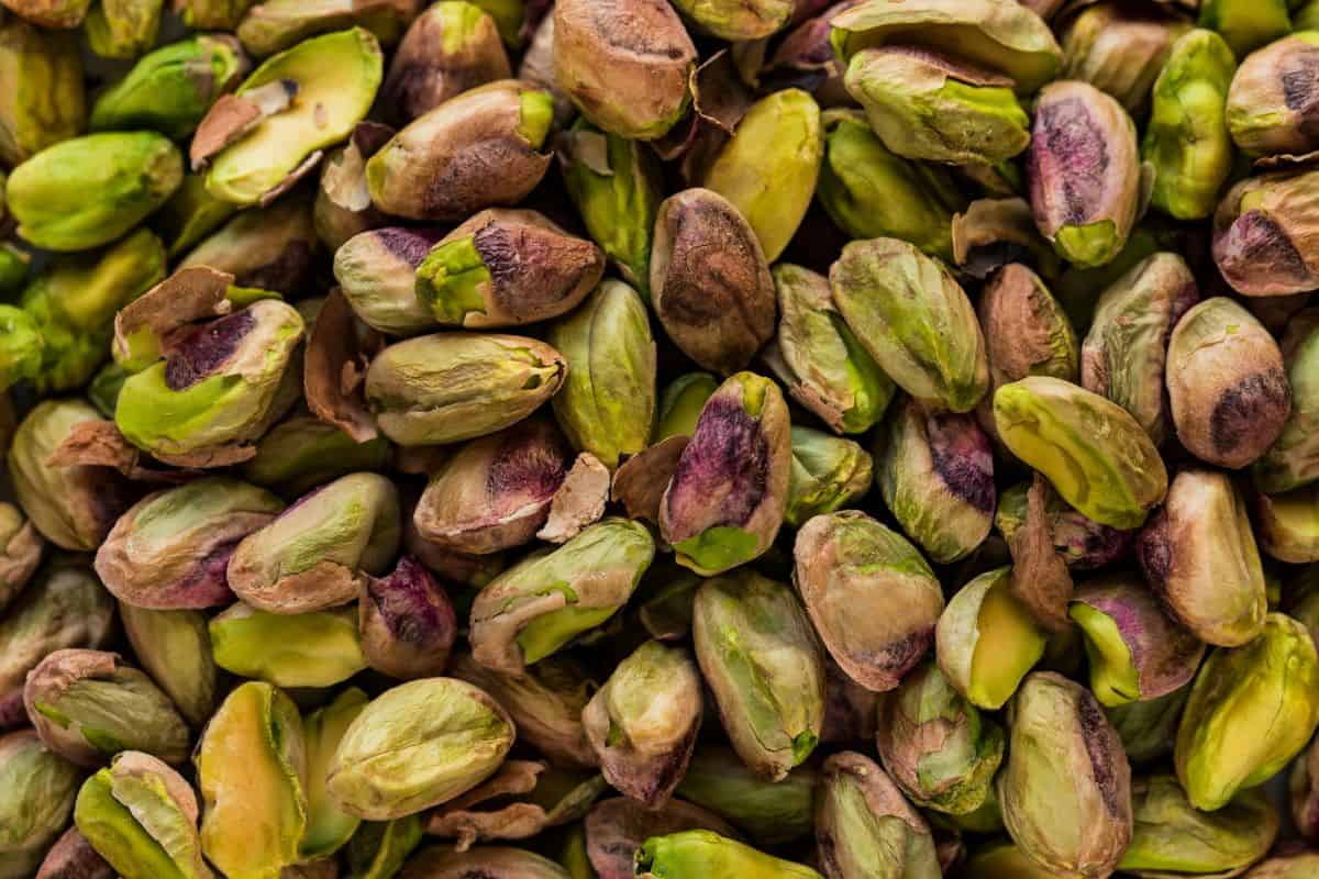 a pile of fresh, roasted pistachio nuts.