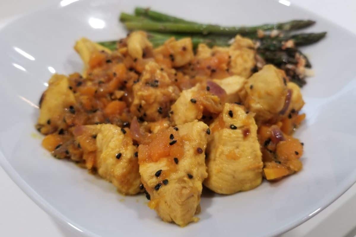 kalonji chicken and squash stew with roasted asparagus.