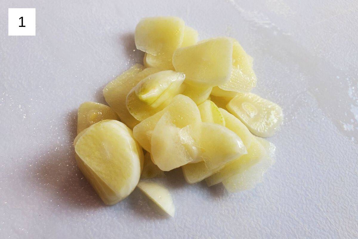 chopped garlic on a white chopping board