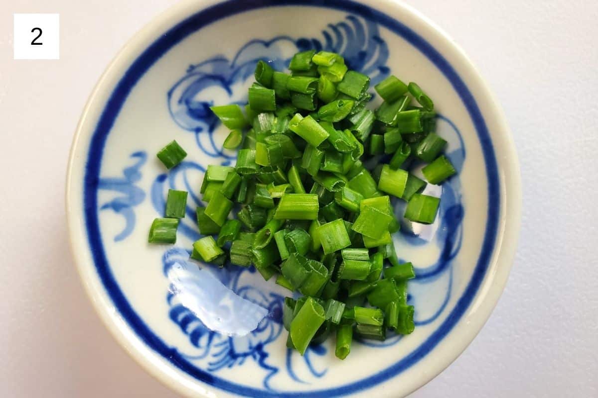 chopped chives in a small glass bowl