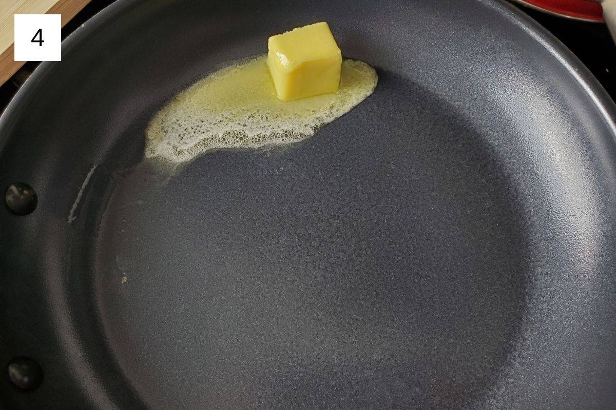 melting a small slice of butter in a pan