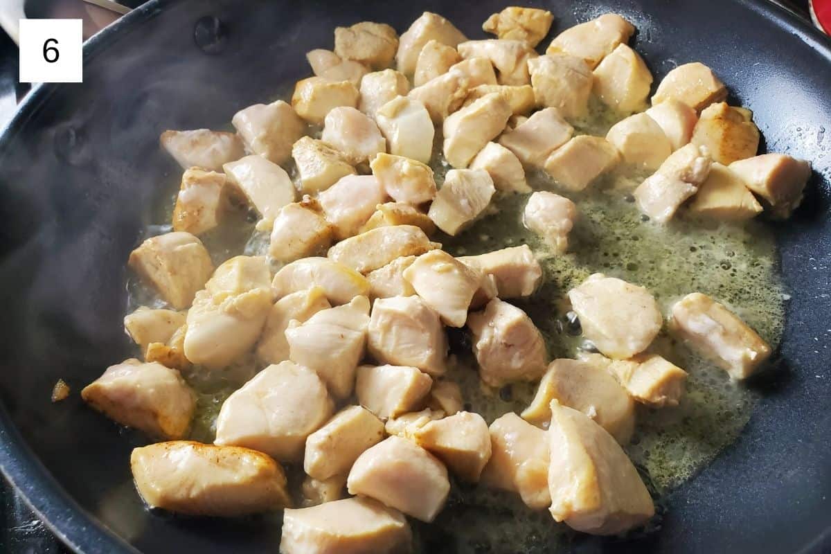 cooking the chicken bits in a pan