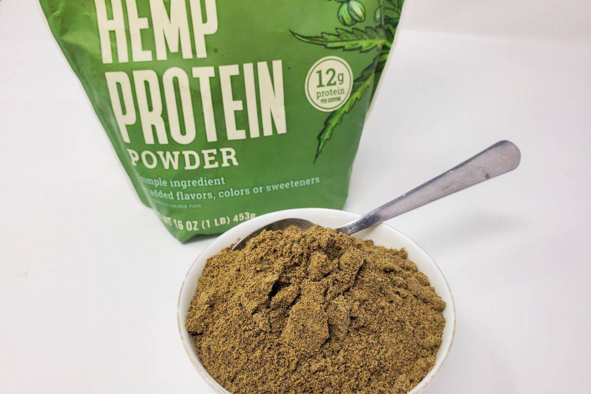 a mug full of hemp protein powder.