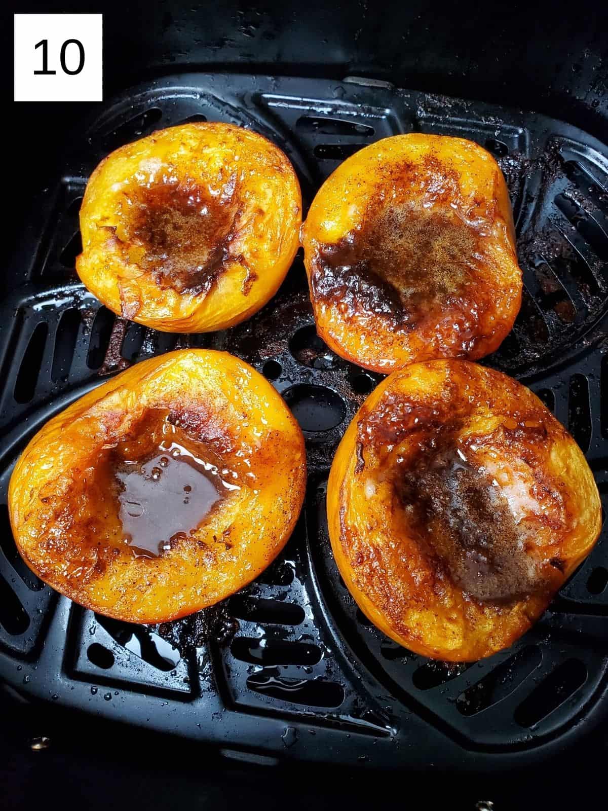 cooked four halves of peaches in an air fryer with spiced butter mixture