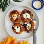caramelized peach halves topped with cream and honey.