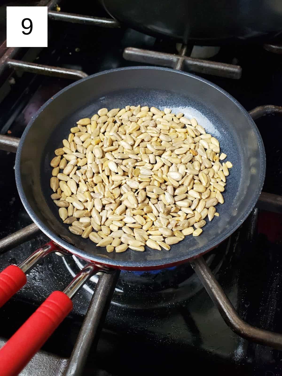 raw sunflower seeds in a pan.