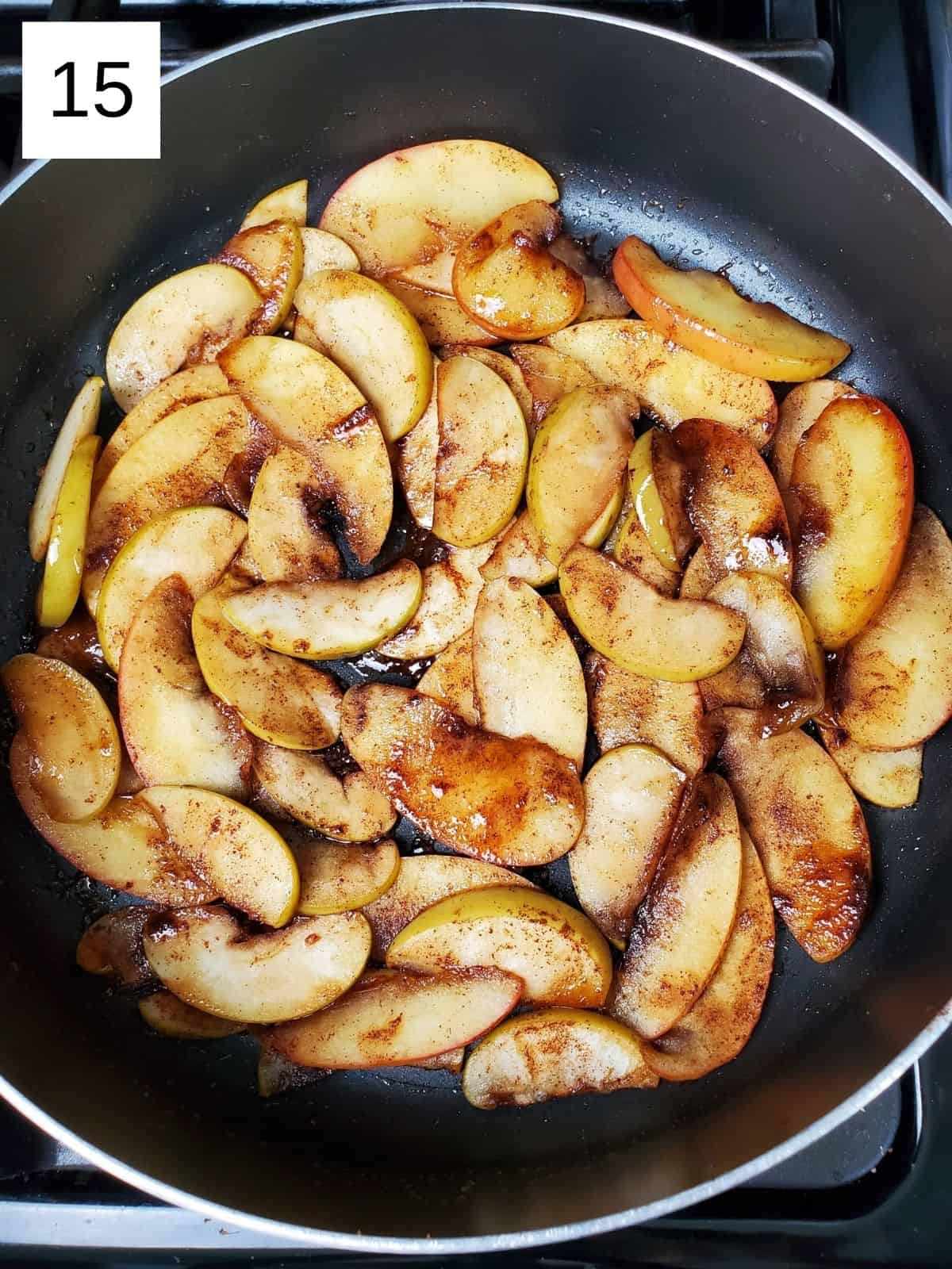 cooked caramelized apples in a pan.