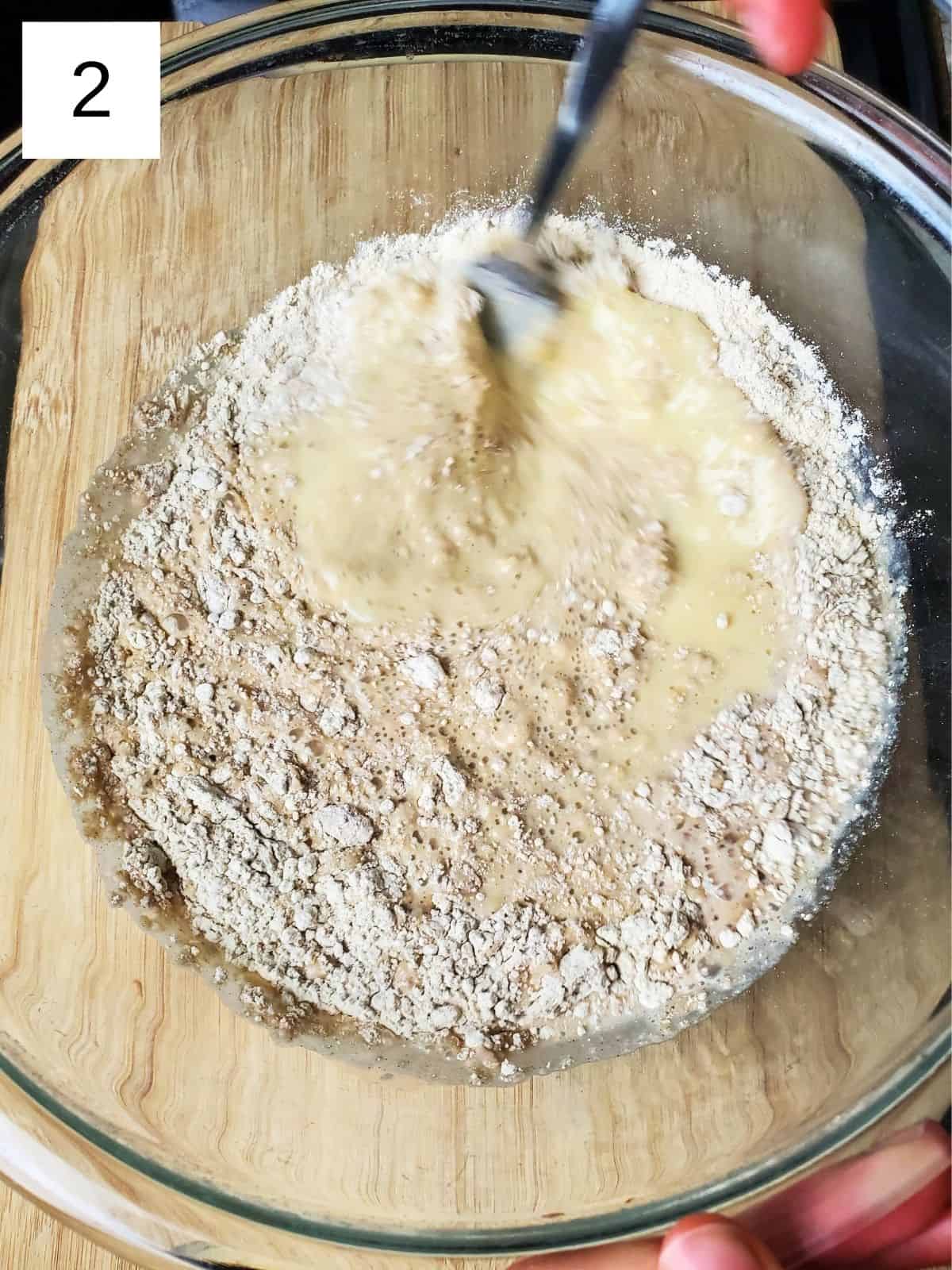 blending the mixture of chestnut flour, milk, salt, and eggs in a large mixing bowl.