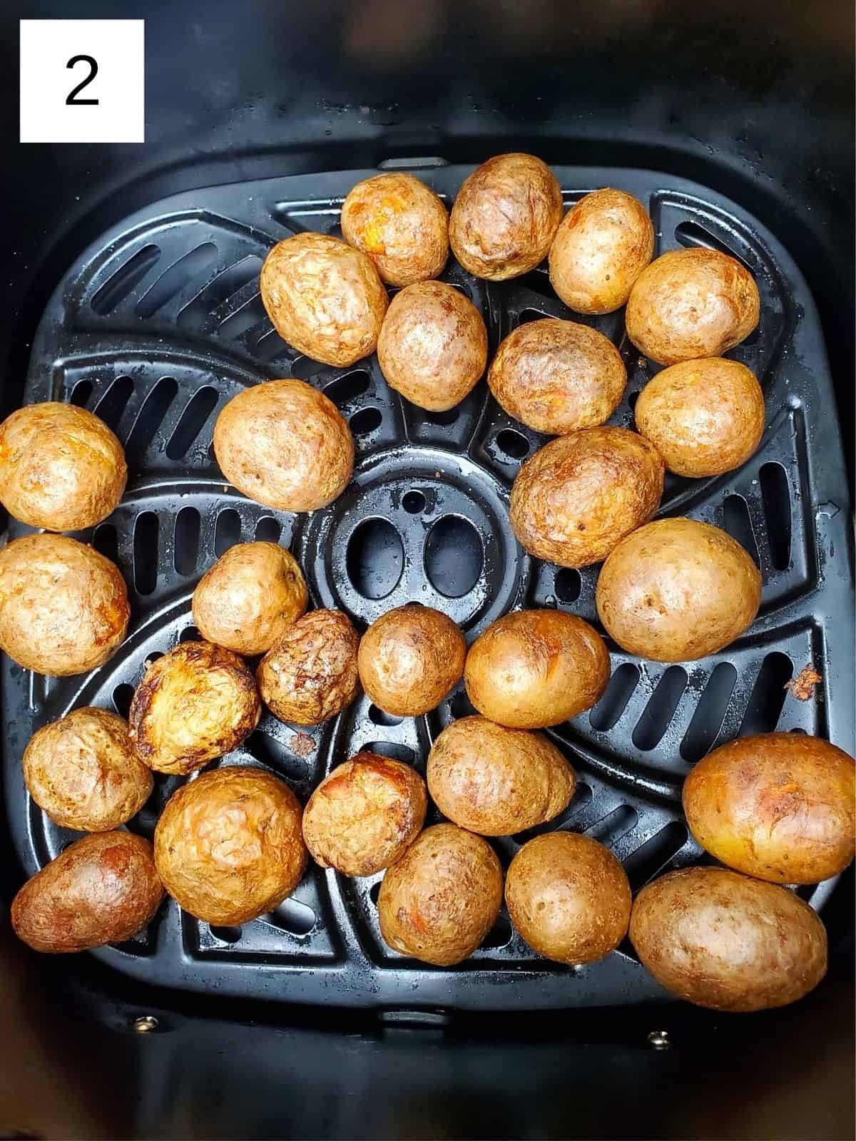 final roasted baby potatoes on a white plate.