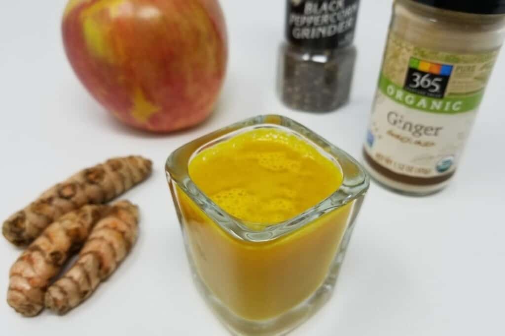 ginger turmeric shot in a glass.