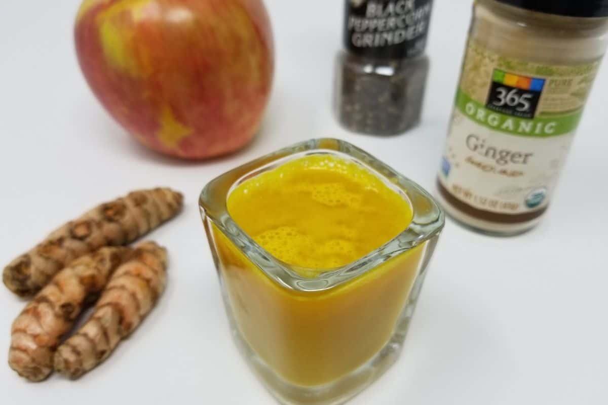 ginger turmeric shot in a glass.