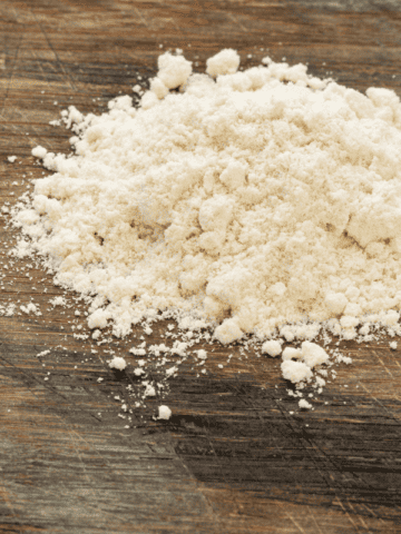 flour on a wooden flat surface.