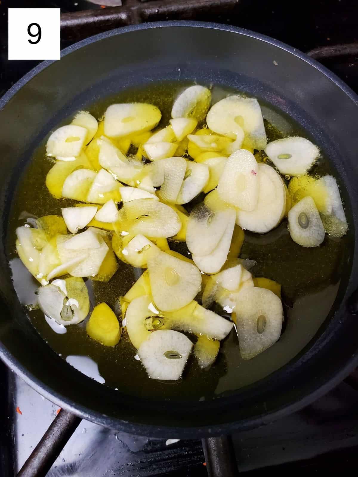 sautéing the garlic slices in a pot using avocado oil.