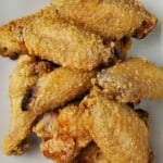 air fried chicken wings on a plate.
