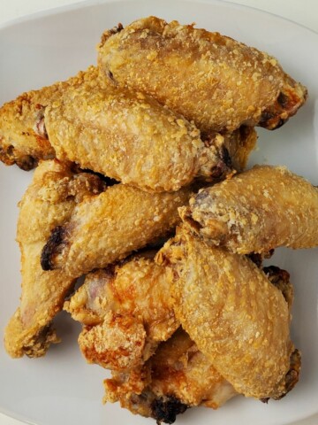 air fried chicken wings on a plate.