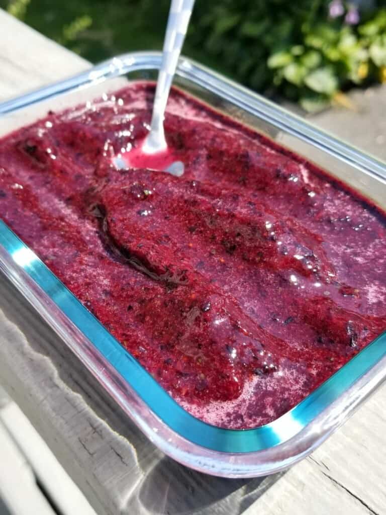 blueberry-basil mixture in a glass container.