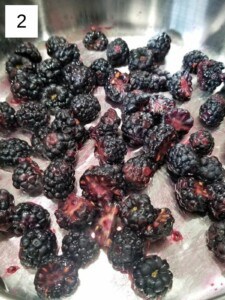 sliced blackberries in a saucepan.