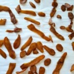 sweetened ginger pieces on parchment paper.