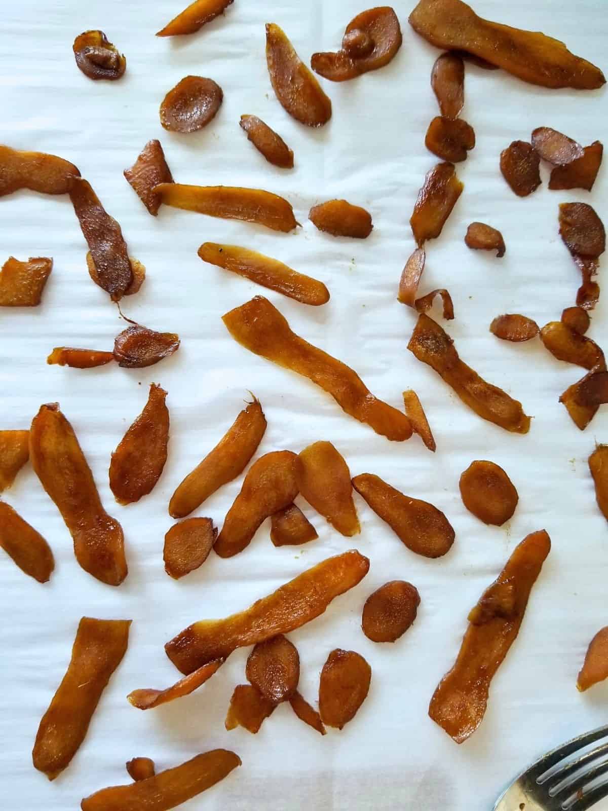 sweetened ginger pieces on parchment paper.