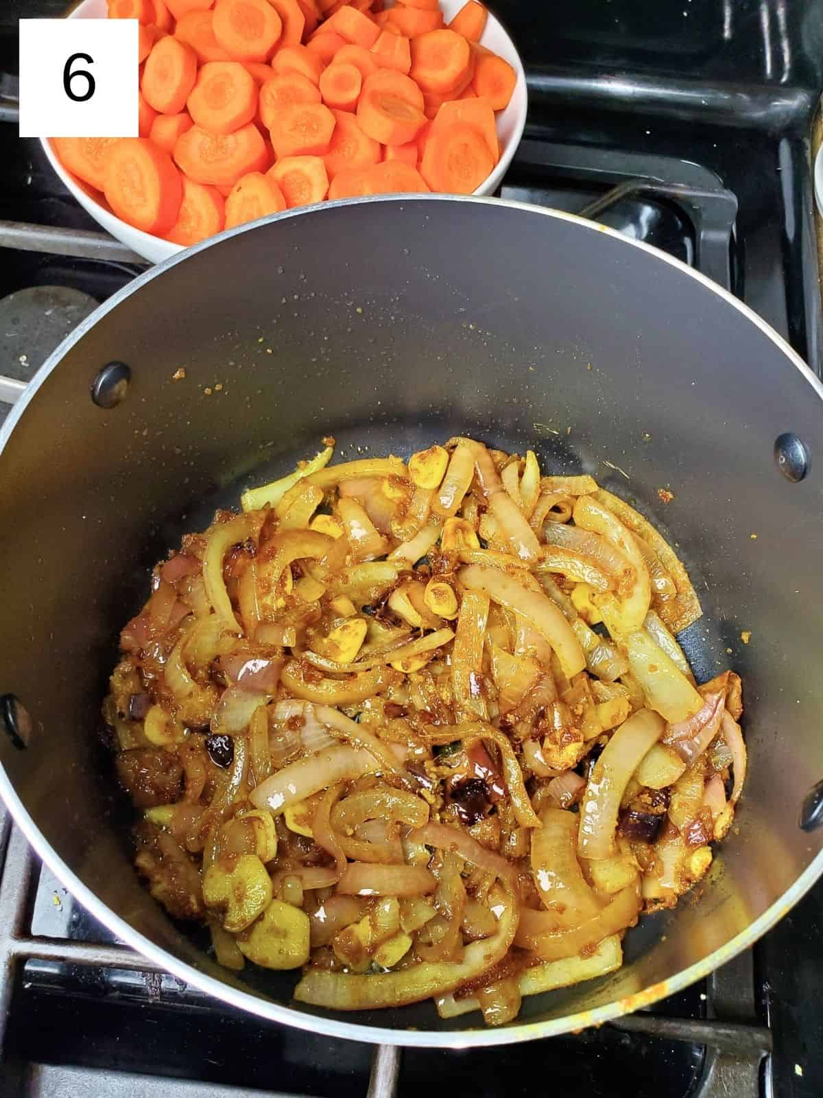 browned, seasoned onions in a pot.