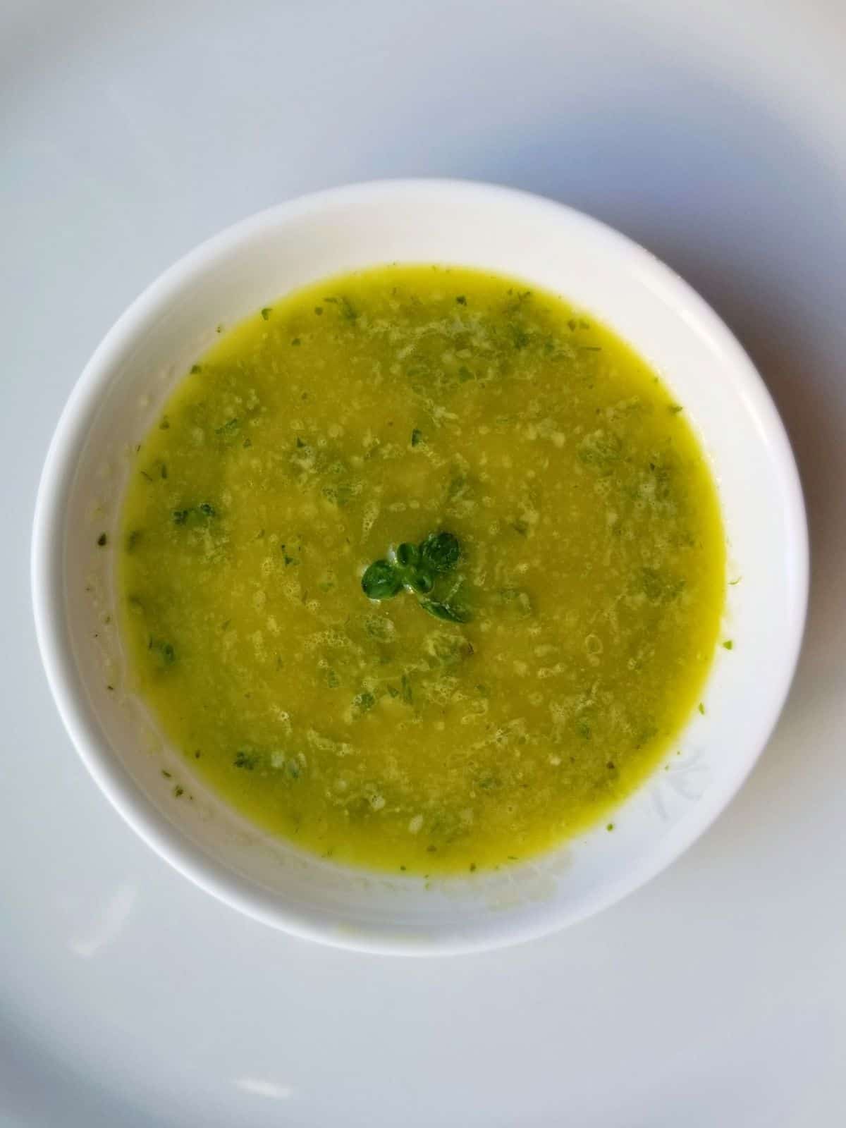 herb salad dressing with garlic in a bowl.