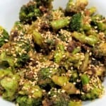 stir fried garlic tahini broccoli in a bowl.