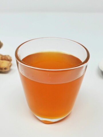 ginger simple syrup in a glass mug.