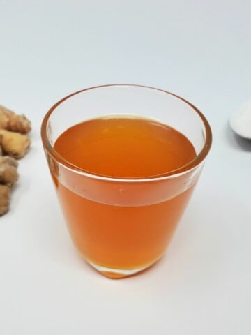 ginger simple syrup in a glass mug.