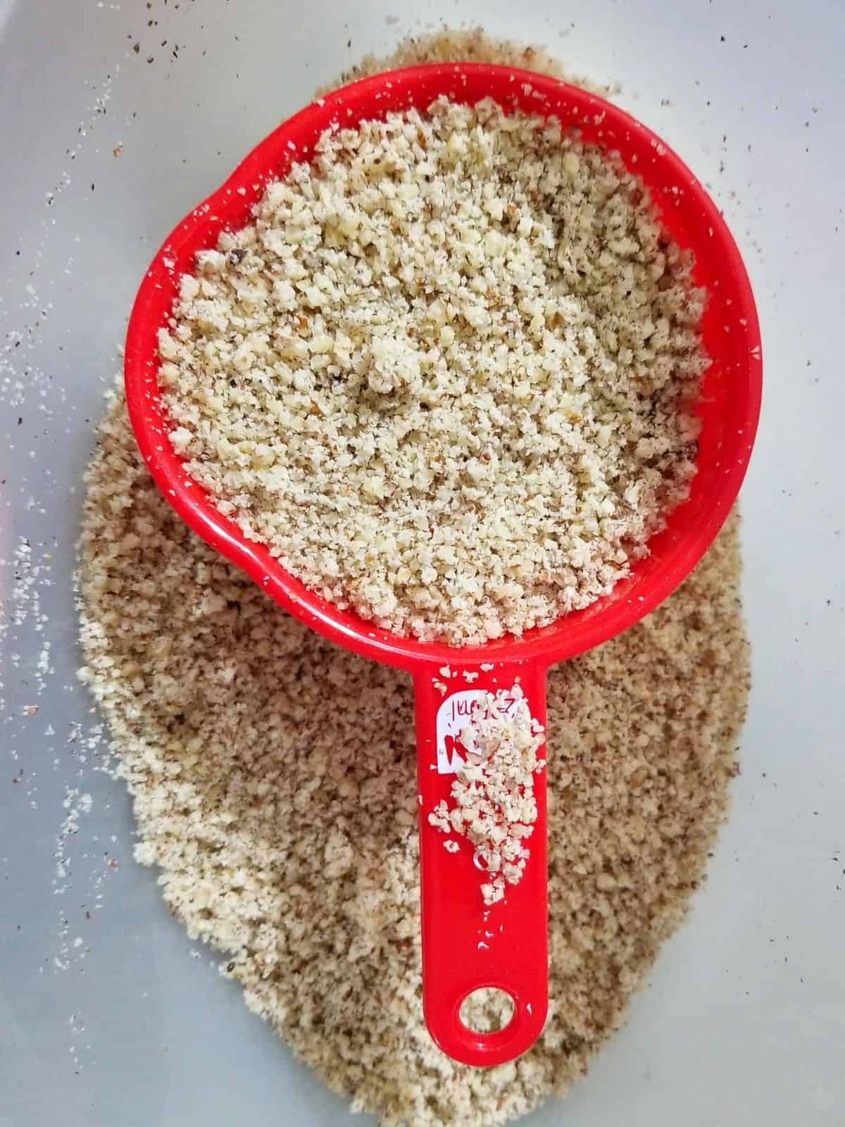 nut milk pulp on a measuring cup.