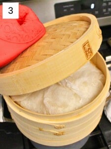 soaked rice wrapped in cheesecloth in a steamer basket on top of a pot of boiling water.